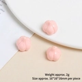 Close-up of mini pink resin garlic charm for DIY crafts, size 16x16mm, set of three pieces - Garlic