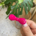Detailed view of a glossy magenta bow hair clip with golden Barrette la France script - Rose Pink