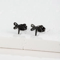 Macro detail of minimalist black dragonfly earring on white stone surface - 108 Dragonfly / Black