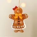Gingerbread man resin ornament with red bow and rustic twine for Christmas tree decor - Yellow Bow Gingerbread Man