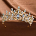 Detailed view of bridal tiara with blue gemstones and rhinestones on gold metal - Gold Blue Opal