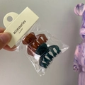 Detail view of mini jelly hair claws in brown and dark cyan with accessories card - Small Keel (Peacock Blue + Coffee)