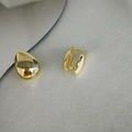 Polished gold teardrop hoop earrings with integrated clasp on a textured background - Gold Teardrop Ear Buckle