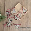 Set of 8 wooden Christmas ornaments with plaid reindeer and tree patterns in box - Style C