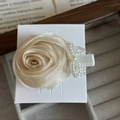 Exquisite handmade beige silk rose hair clip with pearl accents on a white card display - Silk Fabric Pearl Rose Hair Clip / Yellow