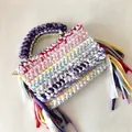 Detail of colorful handmade crochet mini bag featuring vibrant fringe and woven texture - 22*17*5cm / Multicolor