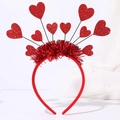 Detail of red sequined hearts and shiny tinsel on a festive party headband - 10 Hearts Headband
