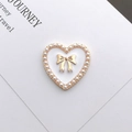 DIY heart charm accessory featuring white pearls and a golden bow for phone cases - Enamel Pearl Heart / White