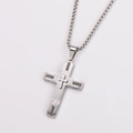 Close-up of silver stainless steel cross pendant with geometric patterns and box chain - Medium / With Chain / Steel