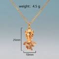 Detail view of gold koi fish pendant with dimensions 25mm x 10mm and 4.5g weight - Style 2