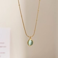 Golden snake chain necklace featuring small beads and an oval light green gemstone pendant - Gold Snake Chain Green Cat Eye (21#)