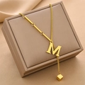 Golden M initial pendant necklace with geometric fringe on a premium jewelry box - Gold Initial M (8847)