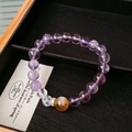 Detailed close-up of crystal bead bracelet with purple amethyst and yellow citrine stones - Purple/Yellow (Purple Firework Crystal Citrine Beaded Bracelet)