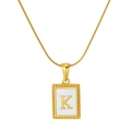 Golden snake chain necklace with square shell pendant featuring engraved letter K detail - Letter K