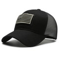 Black mesh trucker cap featuring an American flag patch on the front cotton panel - Black