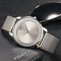 Slim silver business watch with mesh strap displayed on a premium leather wallet - Silver Case White Dial