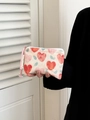 Detail of fabric makeup bag with pink heart patterns and pink woven zipper puller - Small Contrast Pink Heart