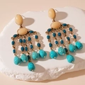 Dettaglio di orecchini vintage dorati con nappe di perline e gocce di turchese - Orecchini a Nappa a Goccia d'Acqua Blu Con Perno in Argento S925