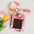 Pink floral card wallet with silicone beaded bracelet, tassel and ID window detail - Pink Floral