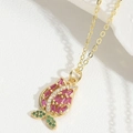 Tulip pendant necklace with pink rectangle gems and green stones on a gold chain - Tulip