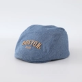 Detailed close-up of blue denim flat cap featuring brown Boston 1630 embroidery - 48cm / Blue