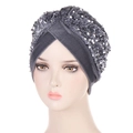 Dark grey velvet turban hat with shimmering silver sequins shown on a mannequin head - Gray