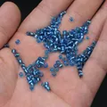 Bright blue glass seed beads for DIY jewelry making held in hand for size visualization - 3mm / 15g / Blue