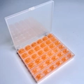 36 Orange Bobbins In A 36-compartment Box / Shuttle Core Storage Box