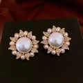 Golden flower earrings with pearls and crystals on a black stand over a red background - Gold Sunflower Pearl