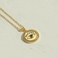 Detailed macro view of gold evil eye pendant necklace with green gemstone and small zircons - Green Gemstone Eye Pendant (XL2982-5)