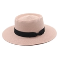 Detail view of pink straw boater hat with fine woven texture and black ribbon bow - M (56-58cm) / Pink