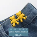 Lemon yellow mini bear waist tightener clips on dark blue denim pants waistline - Hand-sewn Bear / Lemon Yellow