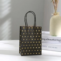 Detail of black paper gift bag with gold foil polka dots and black rope handles - Black Gold Polka Dot Small / 15x11x6cm