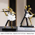 Modern resin dancer figurines in black and gold finish on a sleek rectangular base - Gold Dancers Set