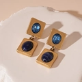 Detail of vintage gold earrings with layered blue resin stones and geometric design - Silver Pin Blue Rhinestone Square Earrings
