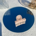 Close-up of pink acetate hair claw clip with marble pattern on a mirror surface - Strawberry Ice