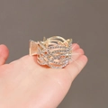 Pince à cheveux dorée pour queue de cheval haute avec strass et tissage ajouré - 6 Rangs Croisés Strass / Or