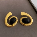 Detailed close-up of golden spiral earrings with black oval resin inlay details - Earrings (Silver Earring Post-Gold-Black-Small)