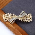 Elegant gold bow hair clip featuring petite pearls and sparkling rhinestones for women - Pearl Bowtie