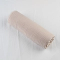 Detail of beige cotton linen scarf featuring natural crinkle texture and frayed raw edges - Beige