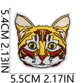 Detailed size specifications for a yellow cat embroidery patch measuring 5.5cm by 5.4cm - No.13 Orange Cat Head