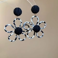 Macro shot of leopard print fabric flower earrings with black knit ball details - Steel Pin Flower Style / Black Leopard