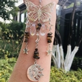 Detailed suncatcher view with crystal prisms, tiger eye beads and butterfly ornaments - Tiger Eye Stone Bracelet