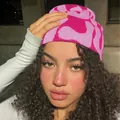 Close-up of hot pink and light pink knitted beanie with abstract jacquard pattern - One Size / Rose Red