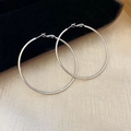 Close-up of polished silver hoop earrings on a black velvet jewelry box with silk fabric - 51# Silver Earring Post - Silver - 60mm Diameter