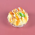 Realistic artificial fruit dessert model with golden pastry, cream topping and mixed berries - Mango