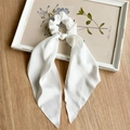 Elegant white satin ribbon hair scrunchie with long streamers on a wooden table - Pure White