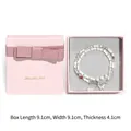Beaded bracelet with butterfly charm in a 9.1cm pink jewelry gift box detail - Pink Bow Decorated Box