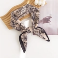 Elegant beige silk-like scarf with black floral print tied in a bow on a wooden tray - 65*65cm / Beige Pink Small Floral