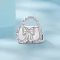925 sterling silver handbag charm featuring a bow design and polished beaded handle - Bow Handbag (SCC2994)